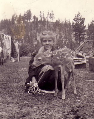 Girl with a young deer in Montana